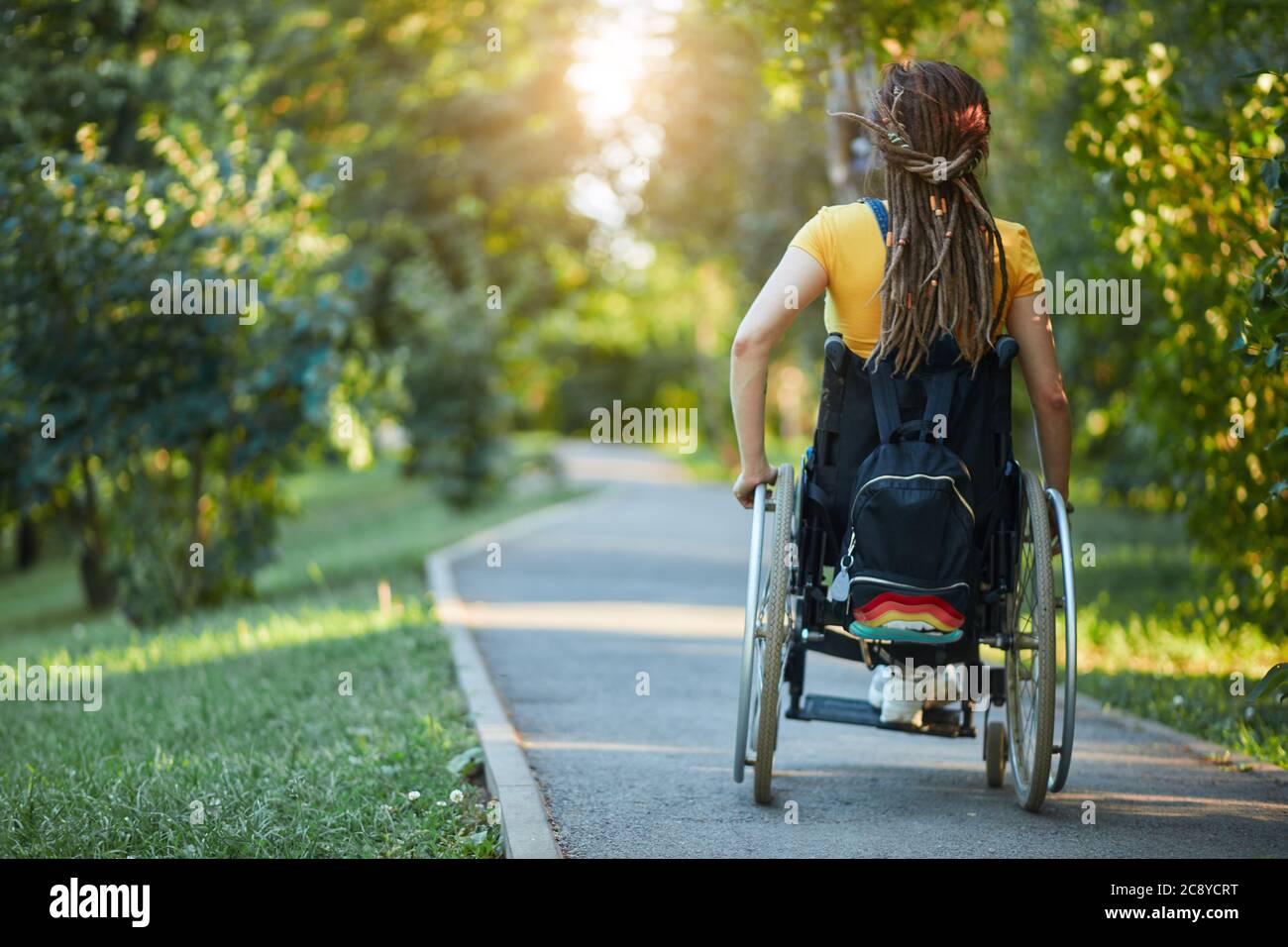 sick girl gets pleasure from life despite her problems with health, close up back view photo. copy space Stock Photo