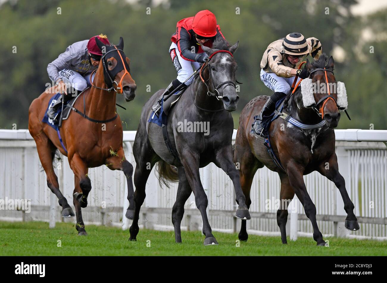 Broughtons Gold ridden by Hayley Turner (centre) wins the Final Furlong Podcast Handicap (Div II) at Royal Windsor Racecourse. Stock Photo