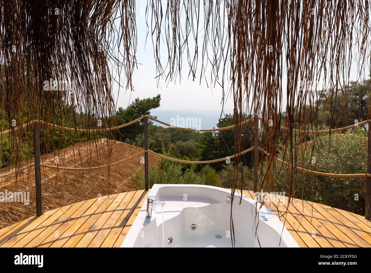 Hot tub in the hotel suite balcony with sea view. Luxury honeymoon