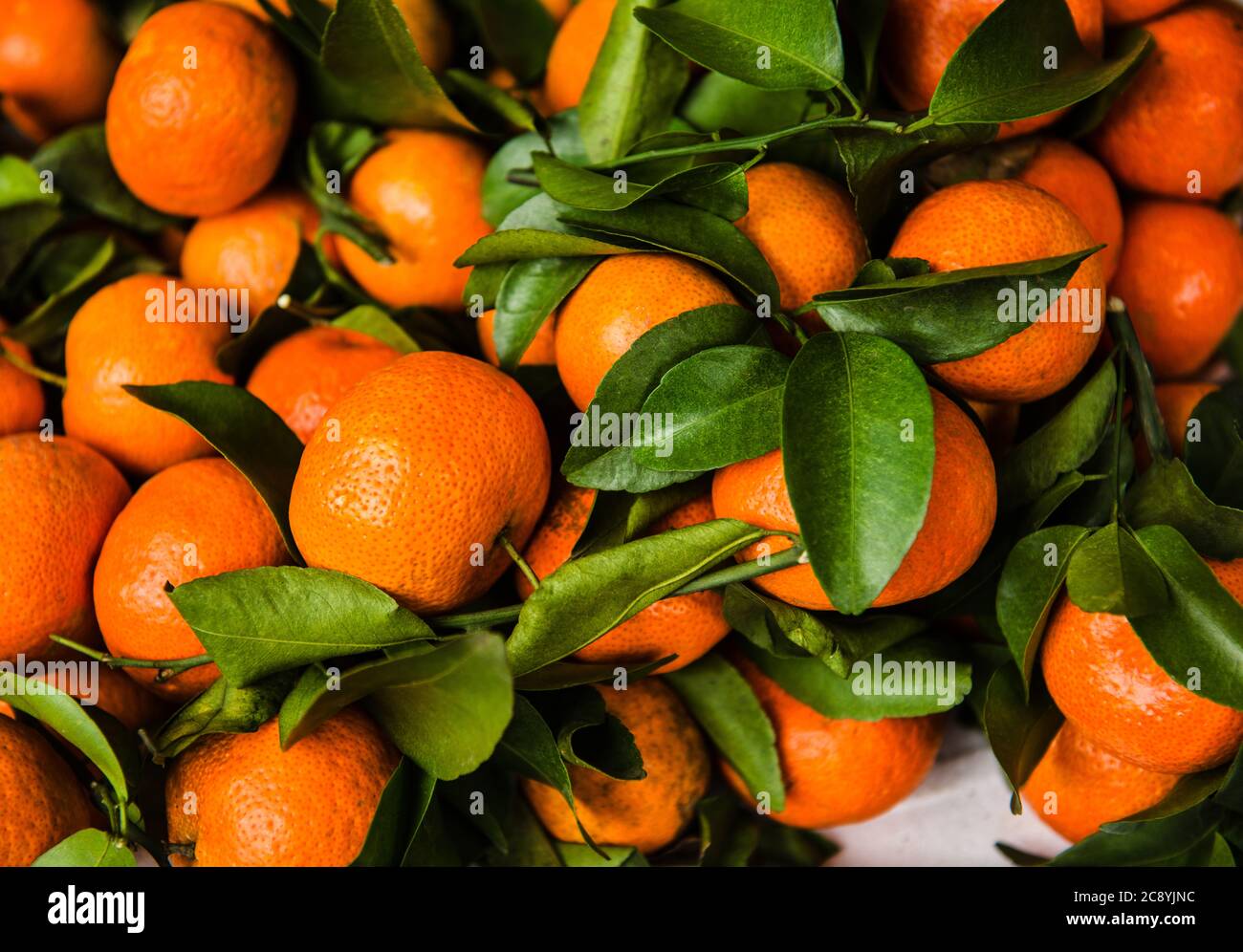 Closeup of oranges for sale at an open market, Vietnam, Southeast Asia