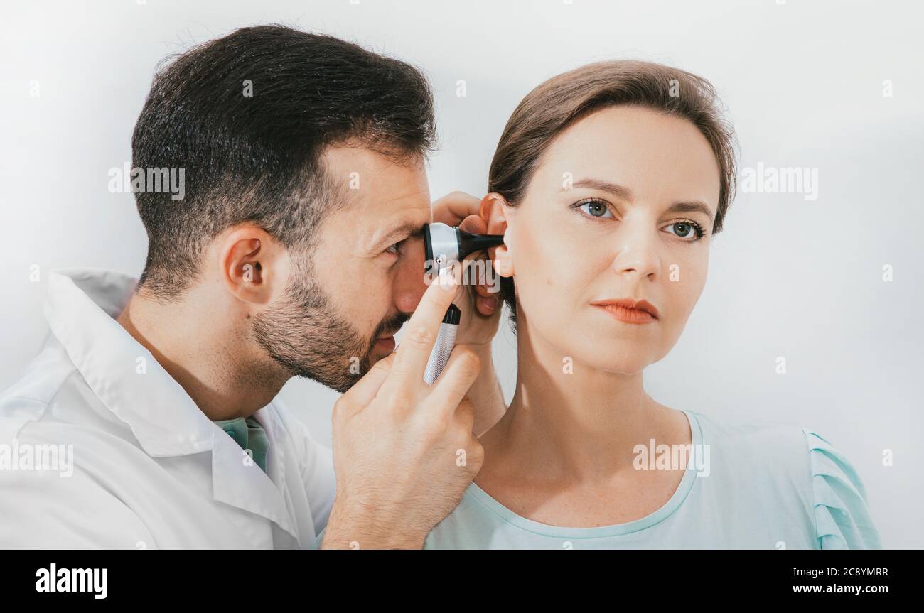 woman-patient-getting-ear-exam-at-the-clinic-experienced-doctor