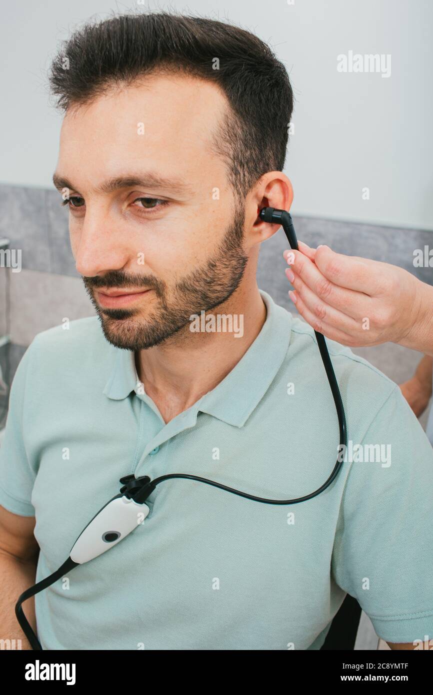Diagnosis of hearing impairment, tympanometry, hearing test. A man