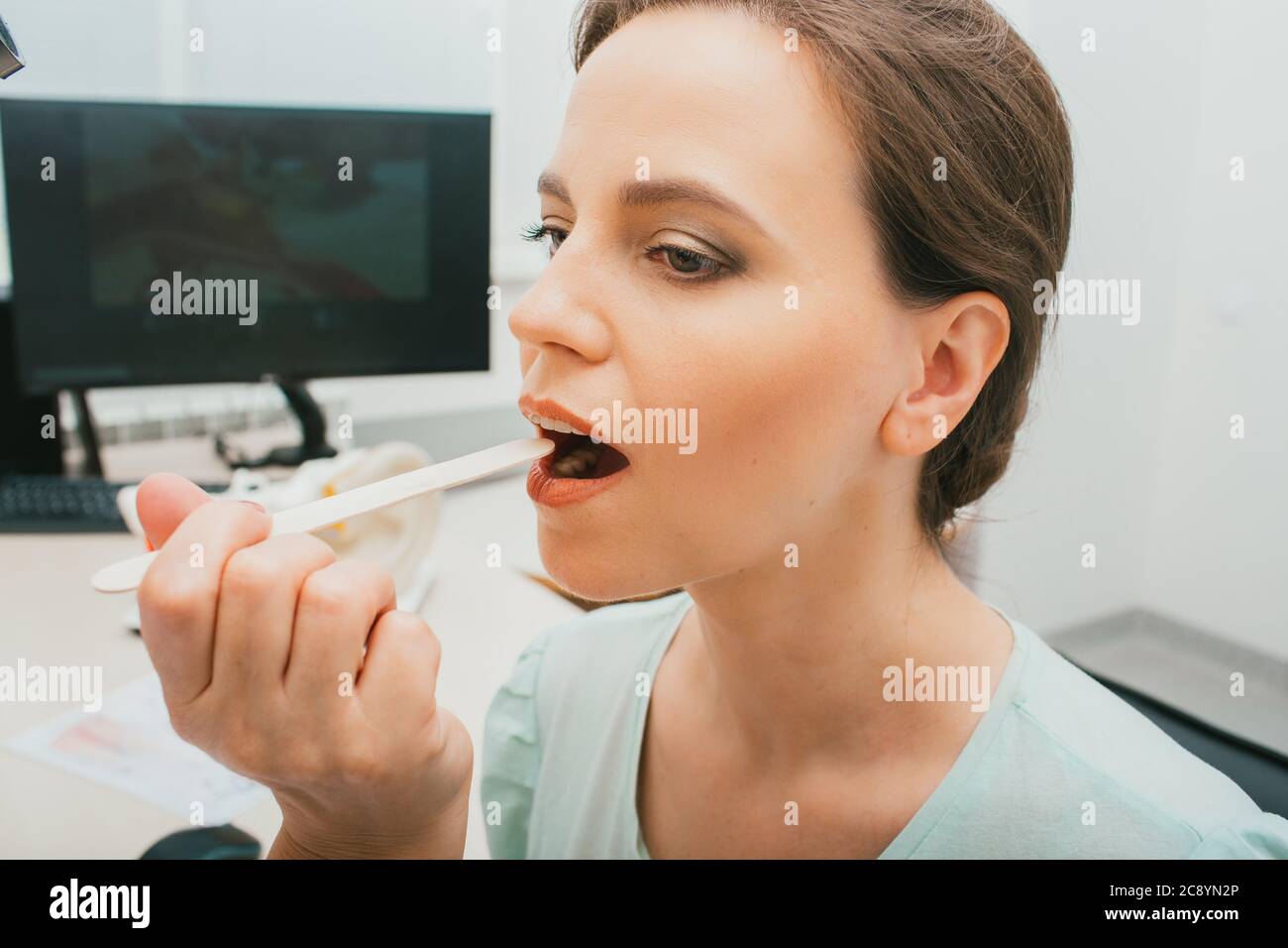 Woman doctor tongue hires stock photography and images Alamy