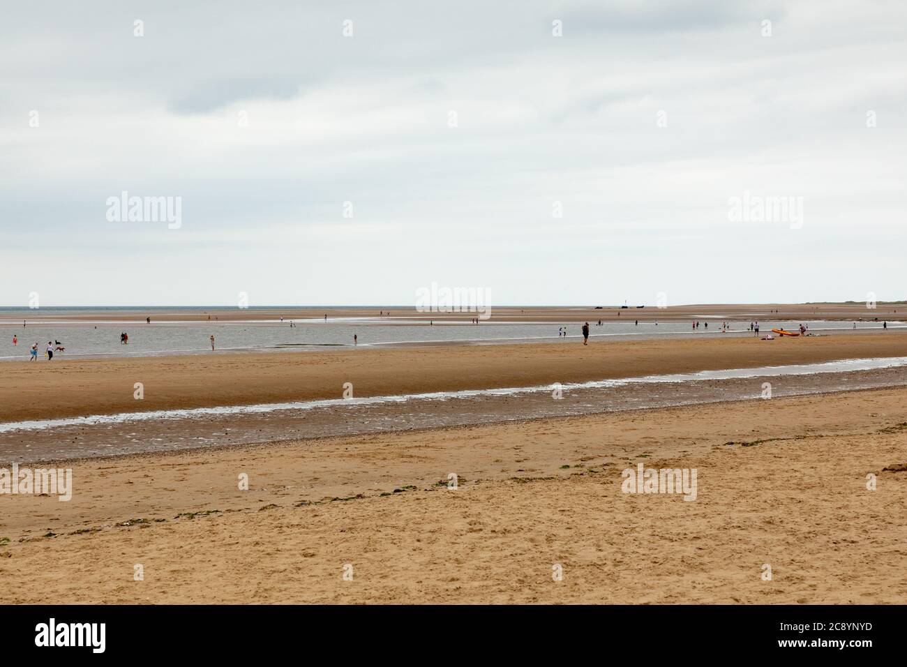 The beach at Brancaster,  Norfolk, UK when the tide is out Stock Photo