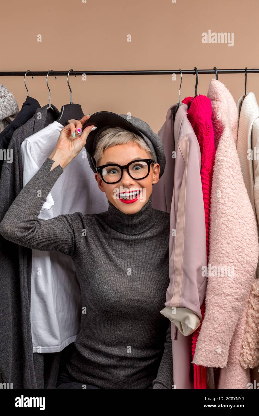 https://c8.alamy.com/comp/2C8YNYR/happy-attractive-stylish-girl-among-clothes-in-wardrobe-close-up-pgoto-spare-time-lifestyle-leisure-activity-2C8YNYR.jpg