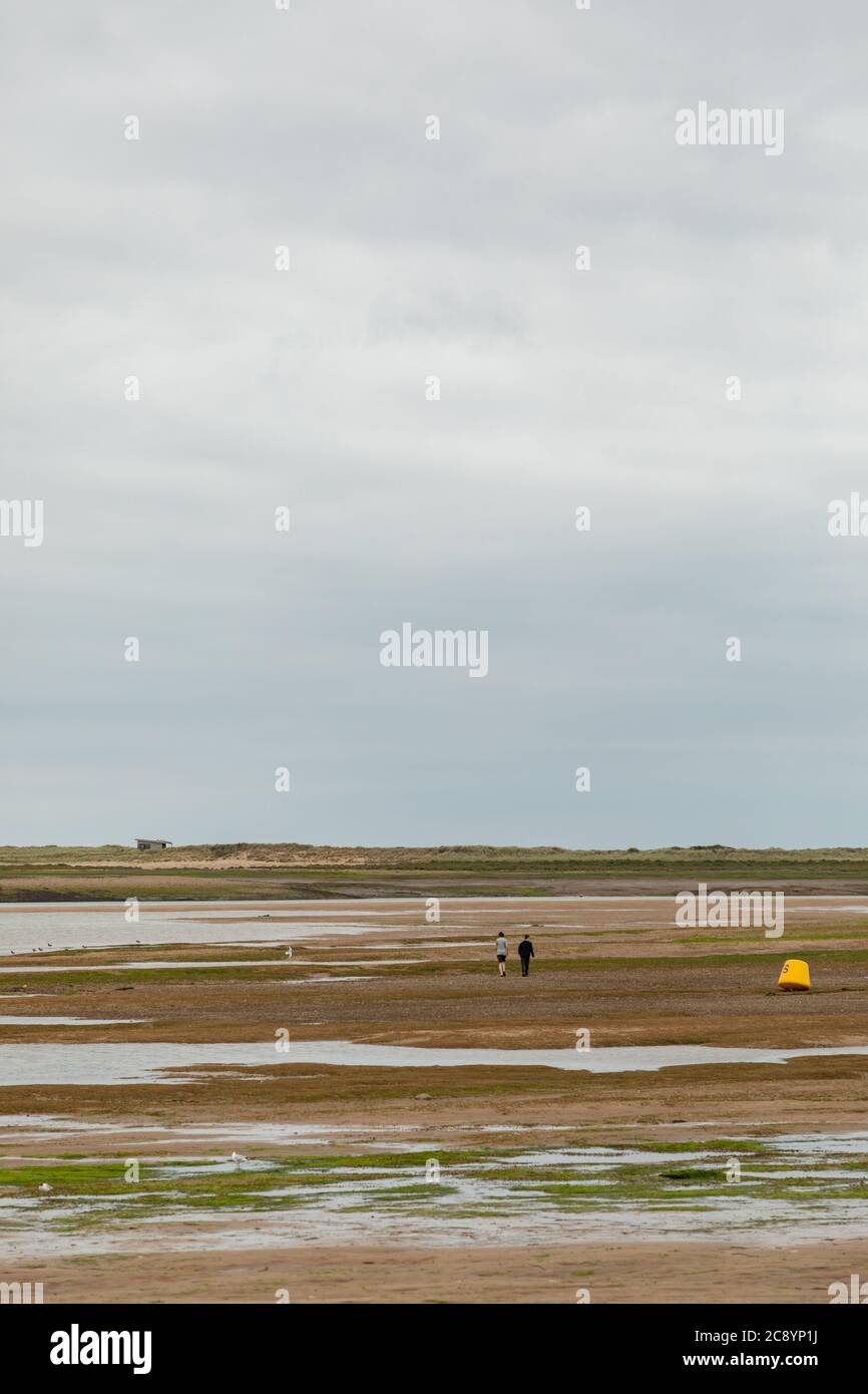 The beach at Brancaster,  Norfolk, UK when the tide is out Stock Photo