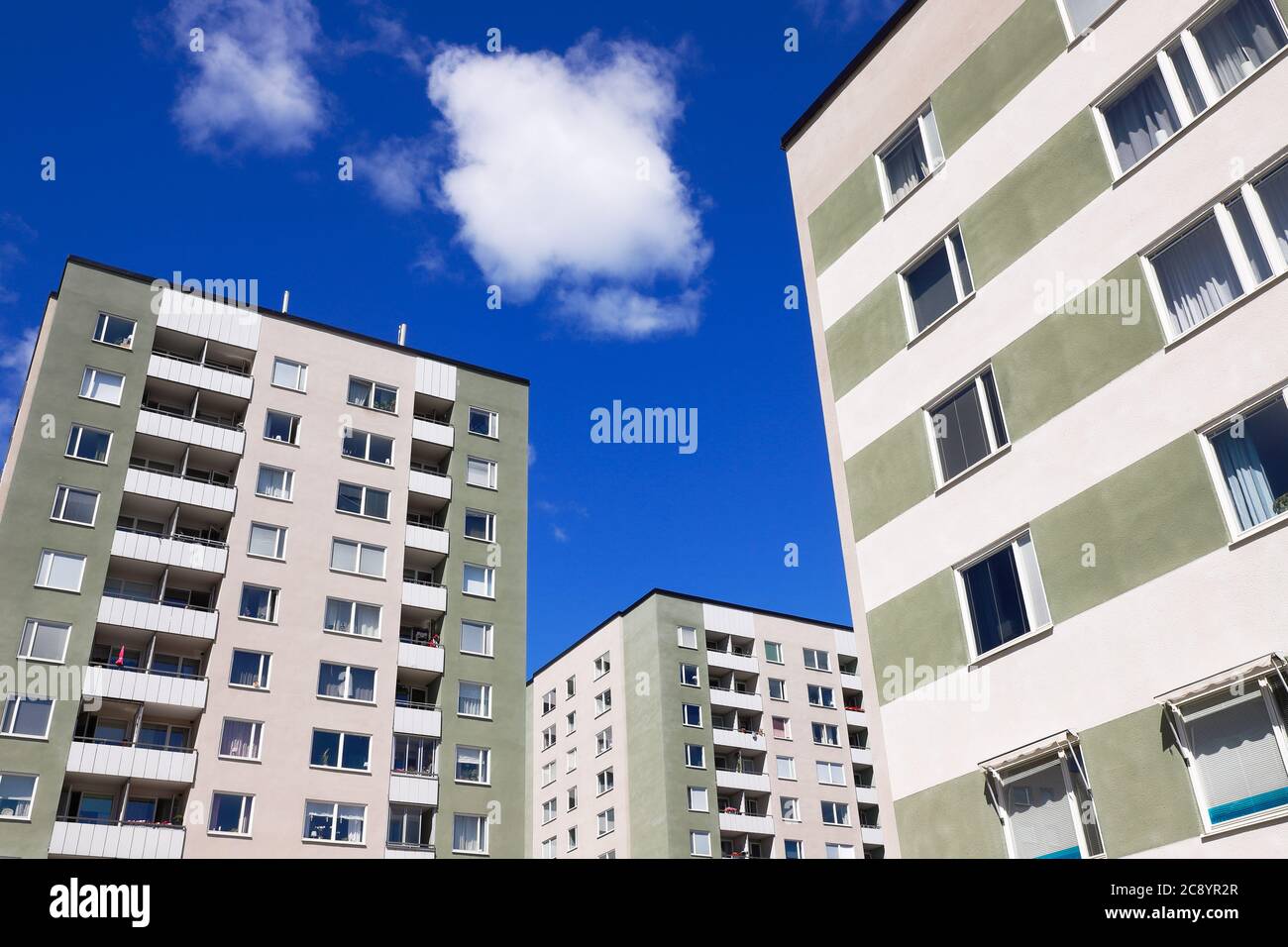 Low angle view of three mid 1960s era multi storey residential buildings. Stock Photo