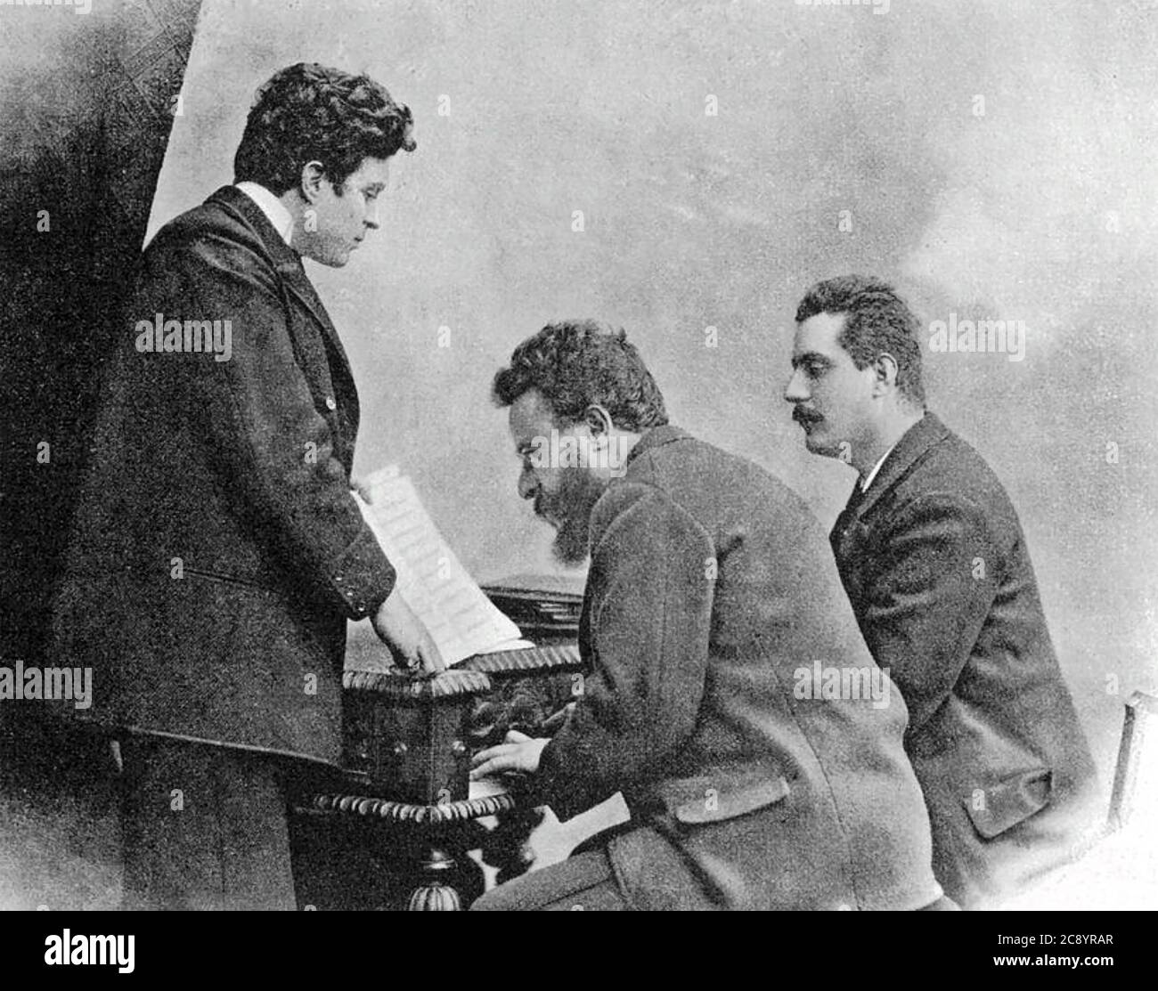 GIACOMO PUCCINI at right fellow Italian composers Pietro Mascagni at left and Alberto Franchetti in 1893 Stock Photo