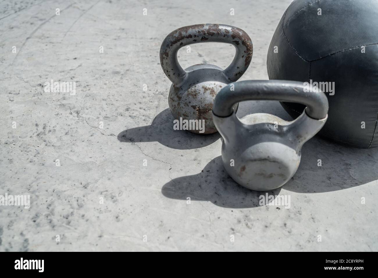Gym kettlebell weights and medicine ball Stock Photo - Alamy