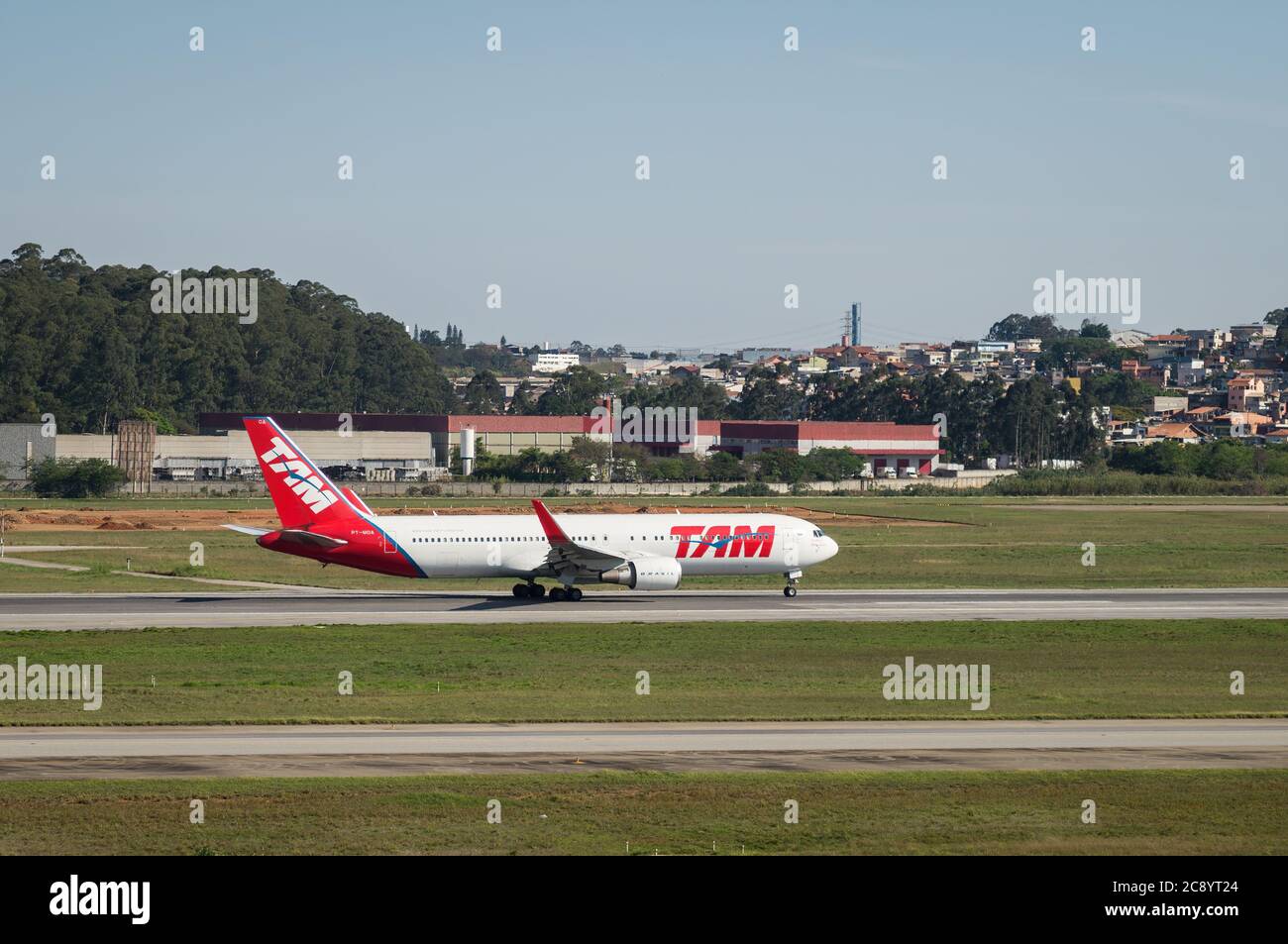 TAM Airlines Boeing 767-316ER (Wide-body twin engine airliner - Reg. PT-MOA) during takeoff run on runway 27R of Sao Paulo/Guarulhos Intl. Airport. Stock Photo