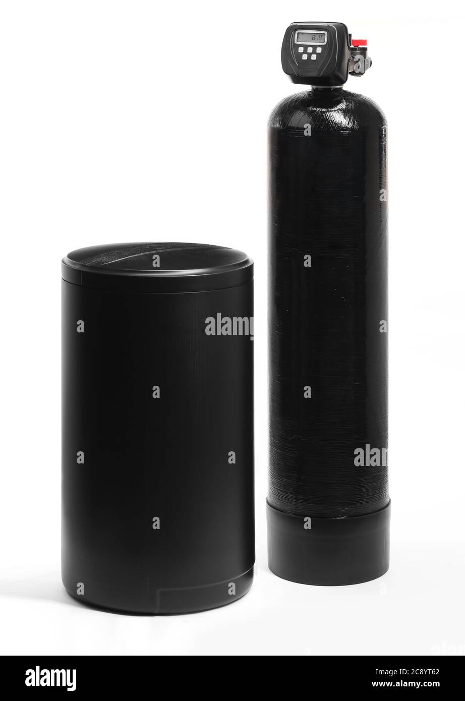 A black, ion exchange style water softener with a brine tank, on a white background in the studio. Stock Photo