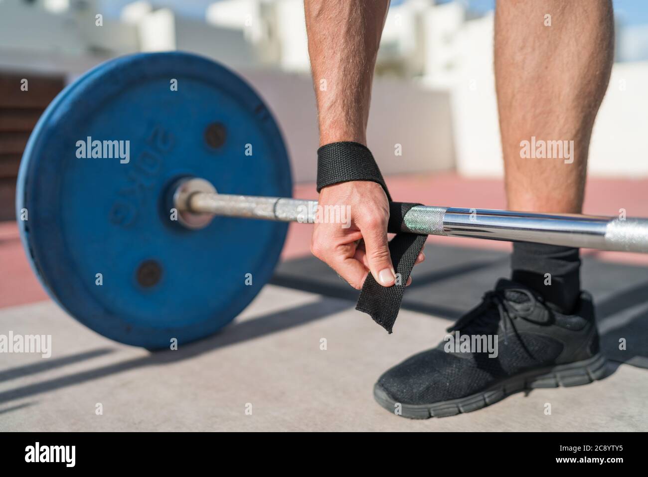 Weightlifting wrist straps fitness man Stock Photo