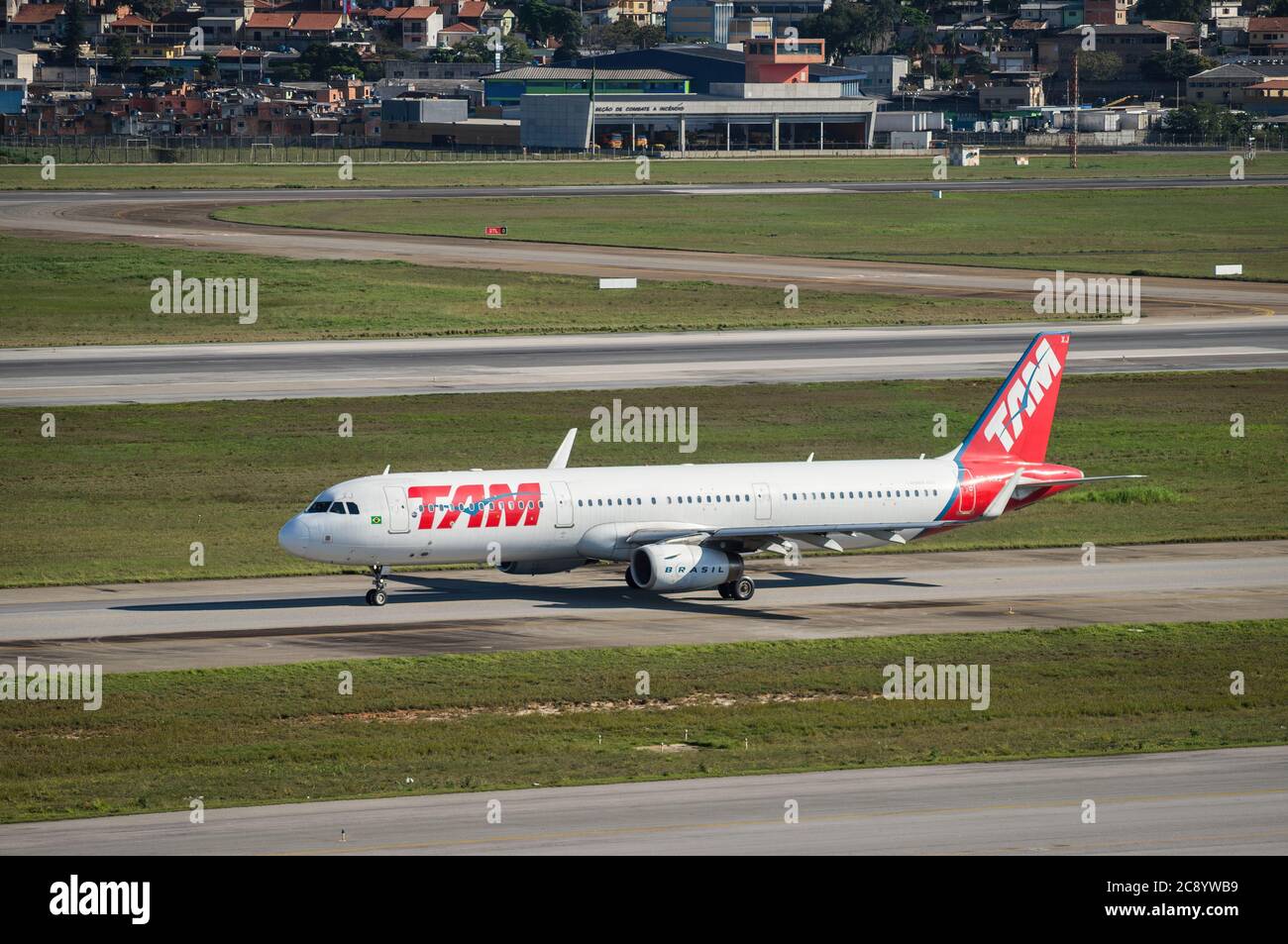 TAM Airlines Airbus A321-231(Narrow-body jetliner - Reg. PT-MXJ) taxing heading runway 27R of Sao Paulo/Guarulhos International Airport. Stock Photo