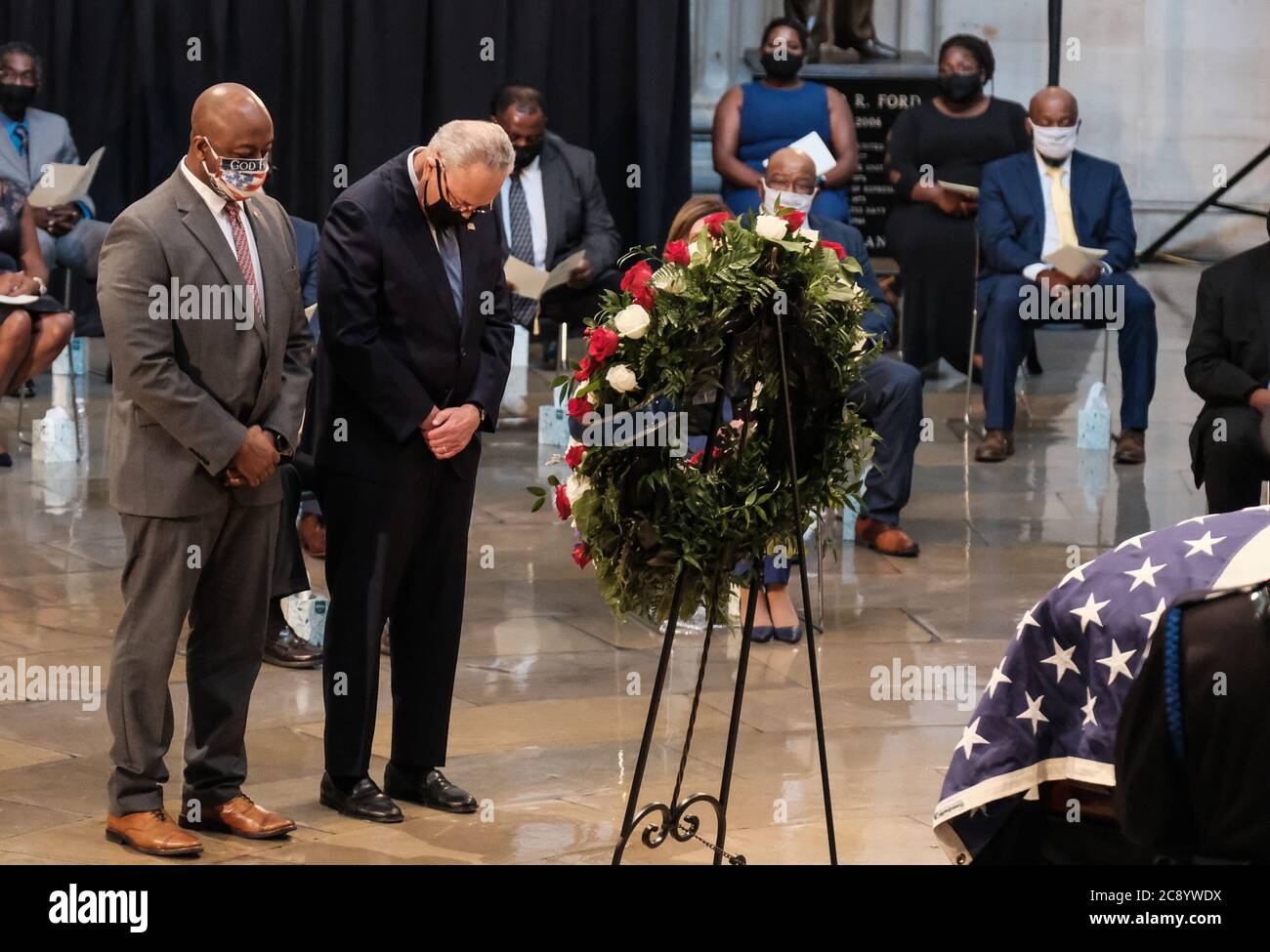 Washington, United States. 27th July, 2020. Senator Tim Scott (L), R-S.C., and Senator Chuck Schumer, D-N.Y., pay their respects to Congressman John Lewis, D- Ga., during a memorial service in the Rotunda of the U.S. Capitol in Washington, DC, on Monday July 27, 2020. Photo by Michael A. McCoy/UPI Credit: UPI/Alamy Live News Stock Photo