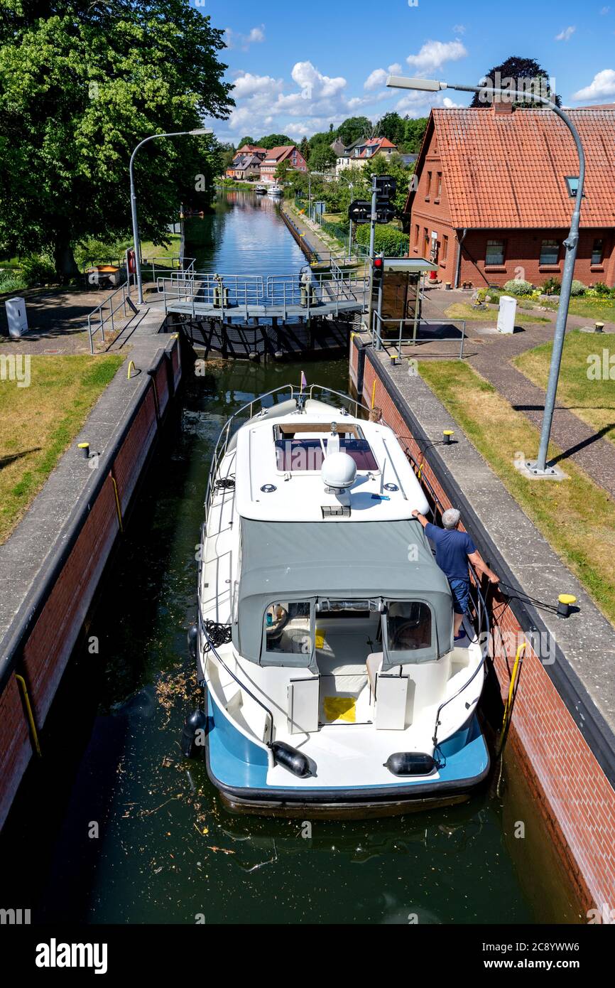 motorboat in the river Elde lock in Plau am See, Germany Stock Photo