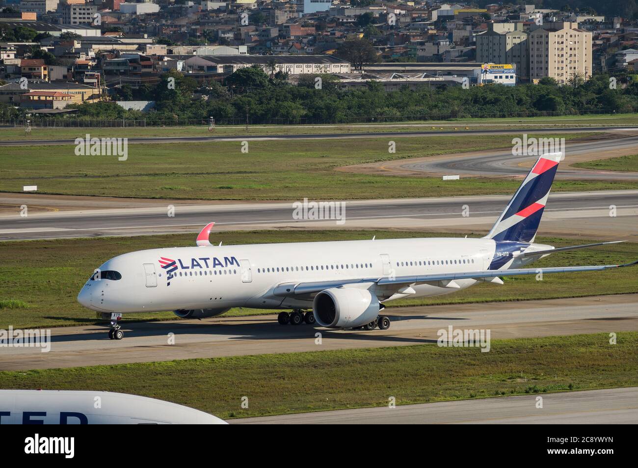 Latam Airlines Airbus 350-941 XWB (Long range wide-body aircraft - Reg. PT-XTD) taxing heading runway 27R of Sao Paulo/Guarulhos International Airport Stock Photo