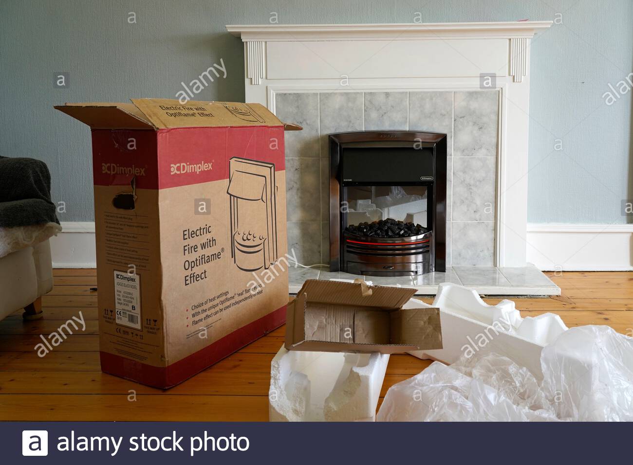 Unboxing and fitting a new inset Electric Fire Stock Photo