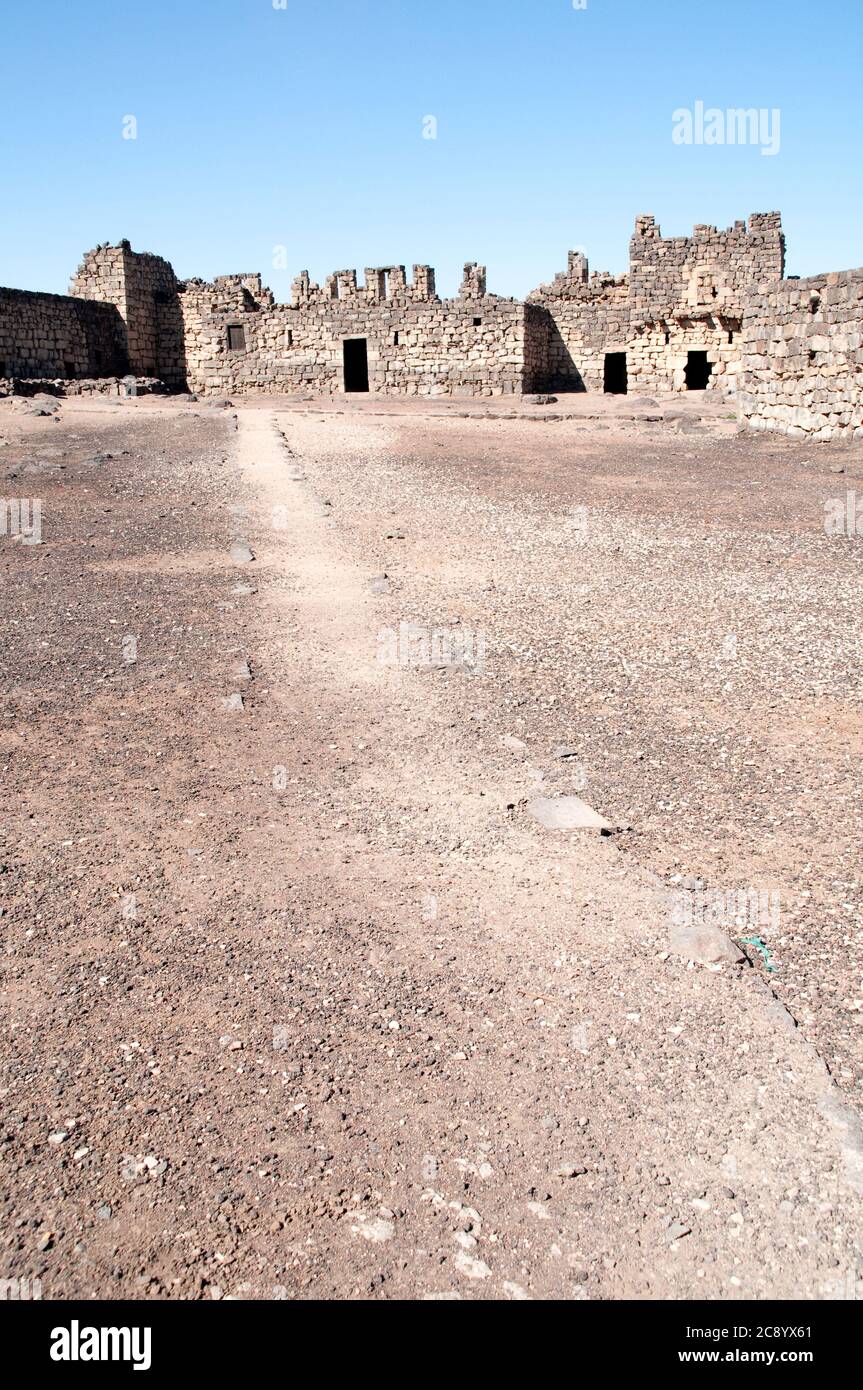 The interior courtyard of the eastern desert castle of Qasr al-Azraq near the town of Azraq, in the Badia region of the Hashemite Kingdom of Jordan. Stock Photo