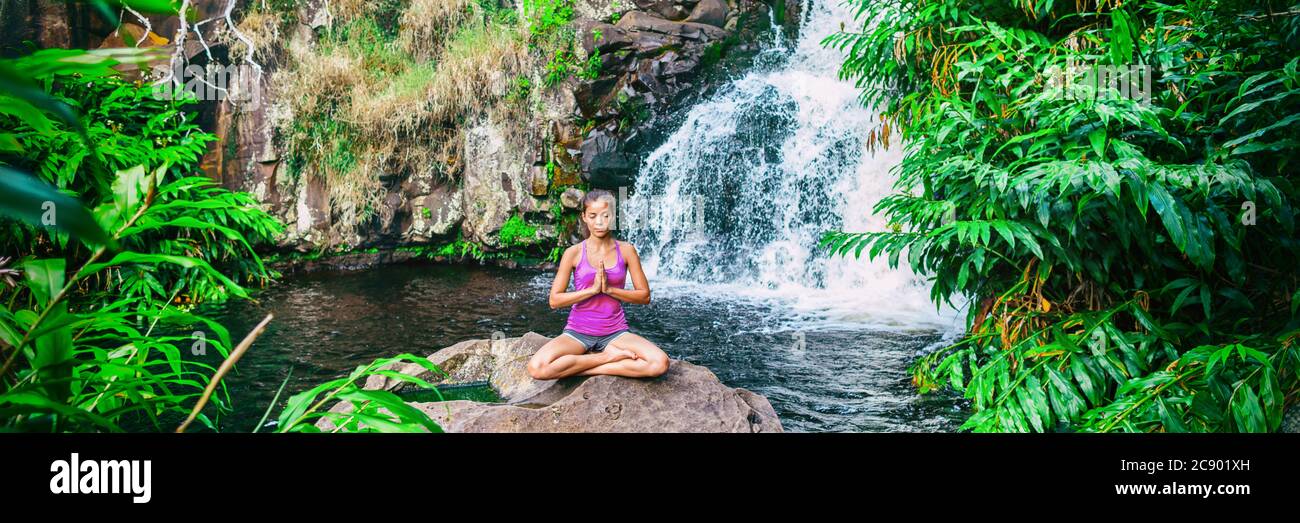 Wellness yoga woman practicing meditation in nature by watefall and ...