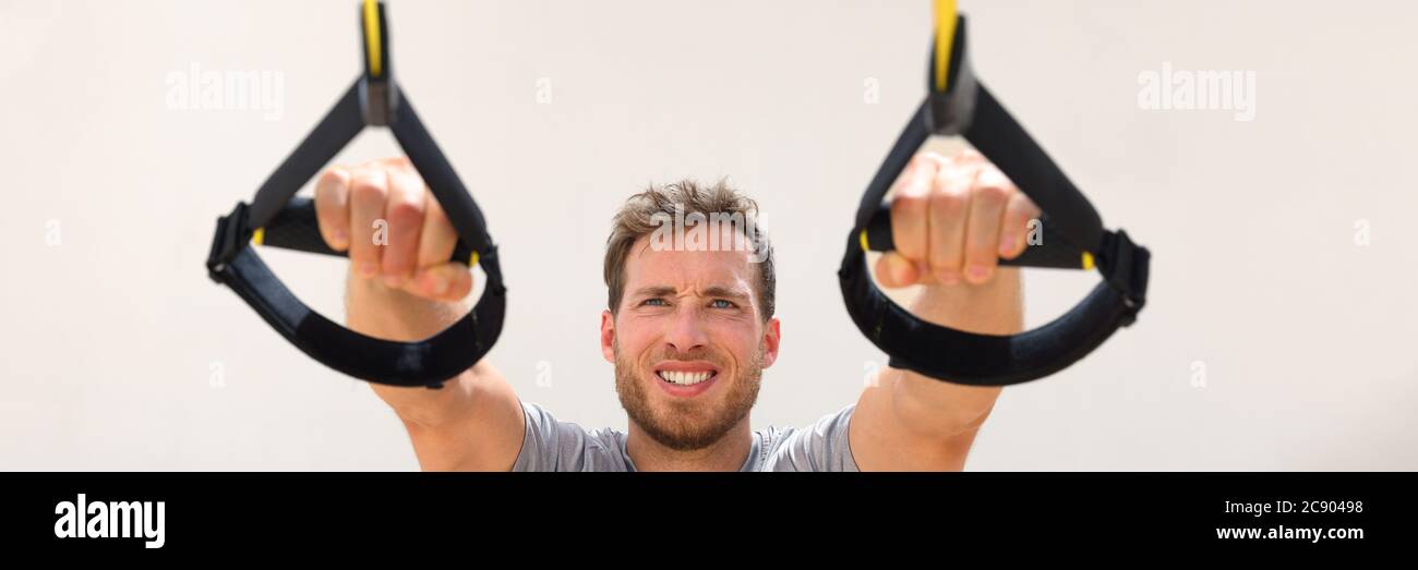 Fitness man trx banner suspension resistance straps training. Athlete