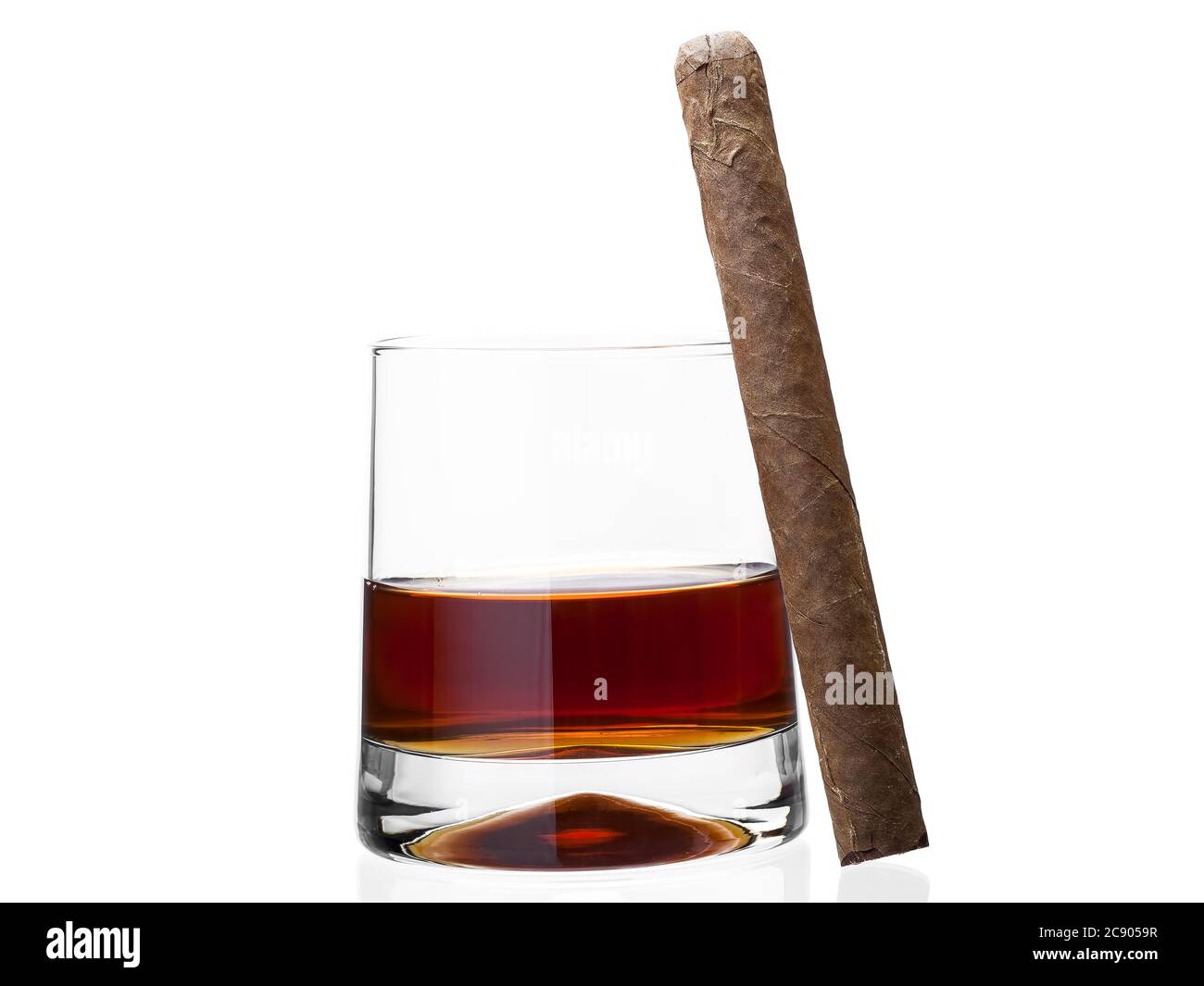 Cigar on a glass of whisky, alcoholic drink with a tobacco product on a white background, nobody