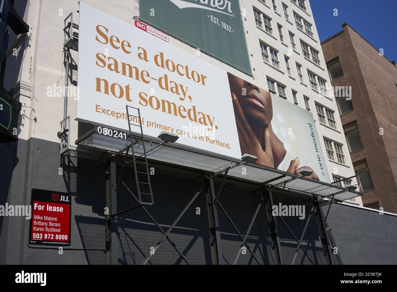 The modernized direct-to-consumer membership-based primary care platform, One Medical's billboard is seen in downtown Portland, Oregon. Stock Photo
