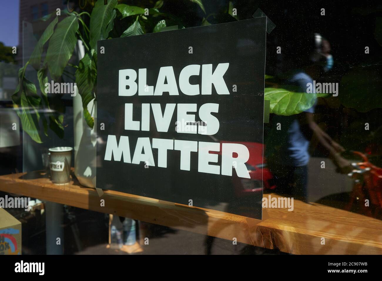 The Black Lives Matter sign is seen on the window at a Stumptown Coffee Roasters location in downtown Portland, Oregon, amid the ongoing BLM movement. Stock Photo