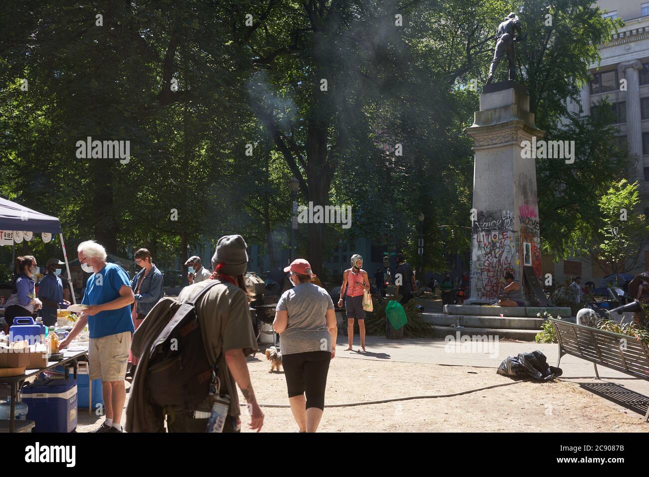BLM protesters turn the Lownsdale Square, a park adjacent to the federal courthouse in Portland, into their hub amid the ongoing demonstration. Stock Photo