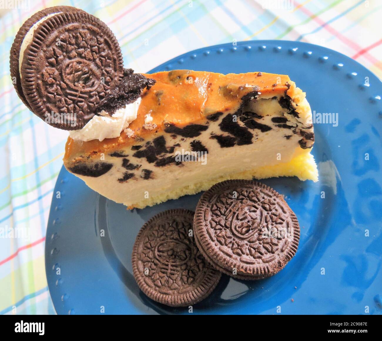 A cheesecake slice with chocolate sandwich cookies Stock Photo
