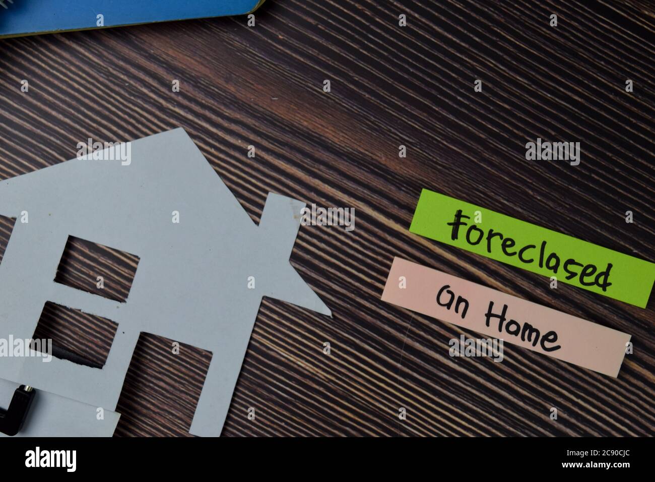Foreclosed on Home text write on sticky notes isolated on office desk. Stock Photo