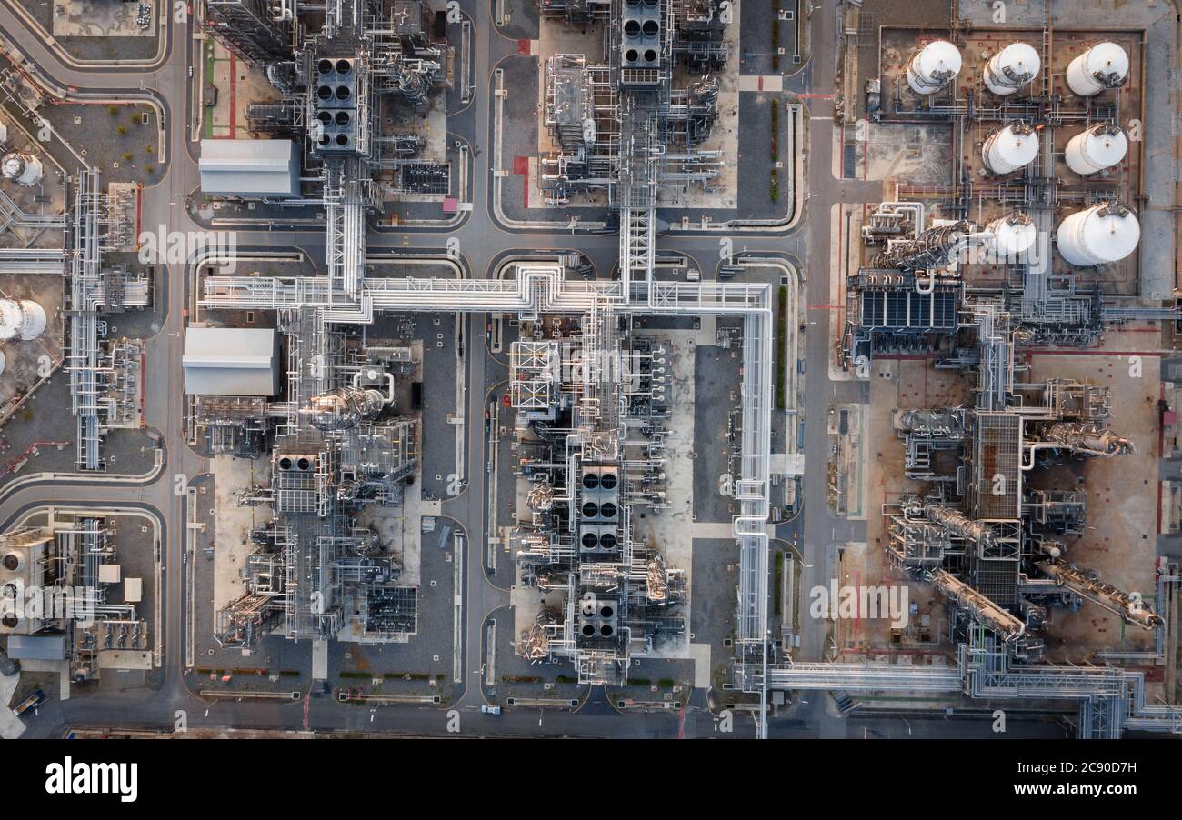 Aerial view of Oil refinery plant in twilight time. Refinery industrial zone. crude oil and gas refining industry at Thailand Stock Photo