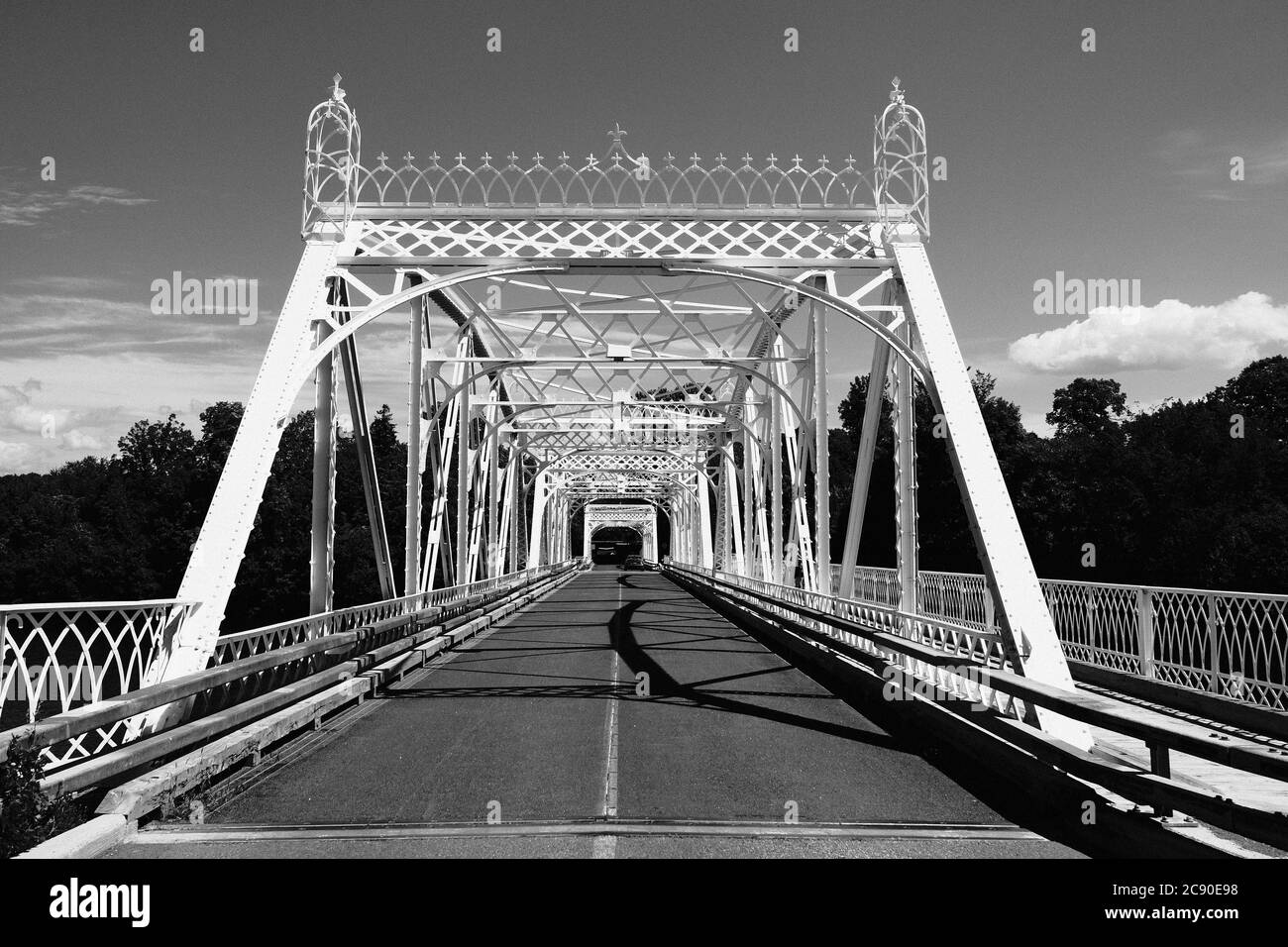 Black & white shot of the ornate cast iron Minto Bridge (actually one of three) spanning the