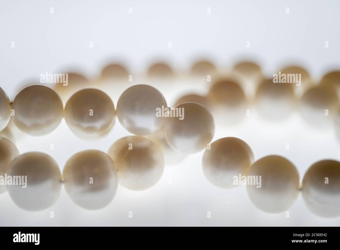Close up of pearl necklace on white Stock Photo