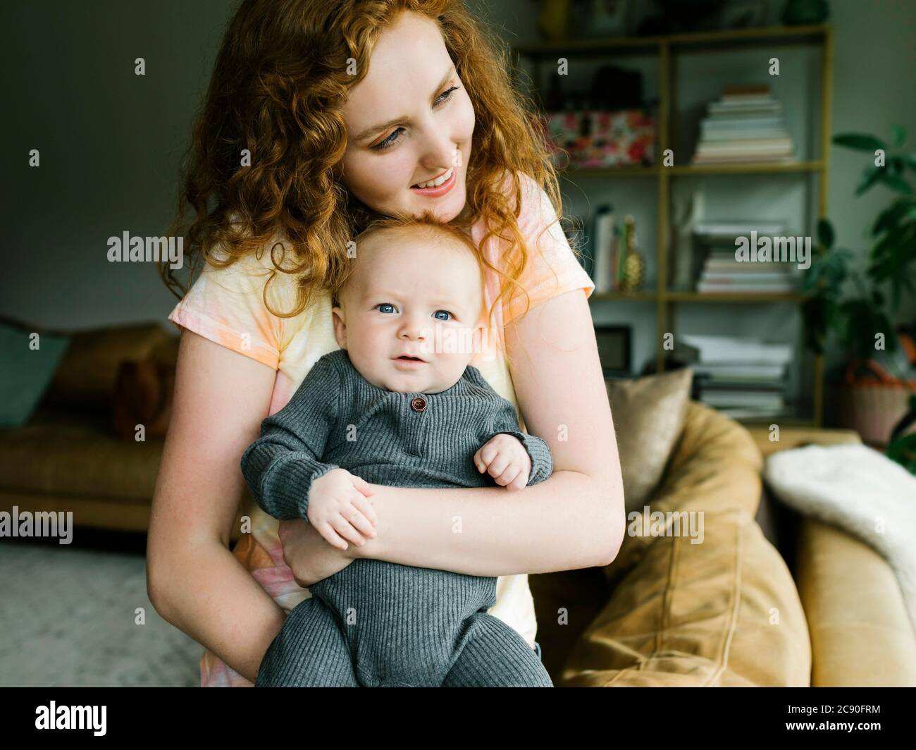Mother holding baby boy (6-11 months) Stock Photo