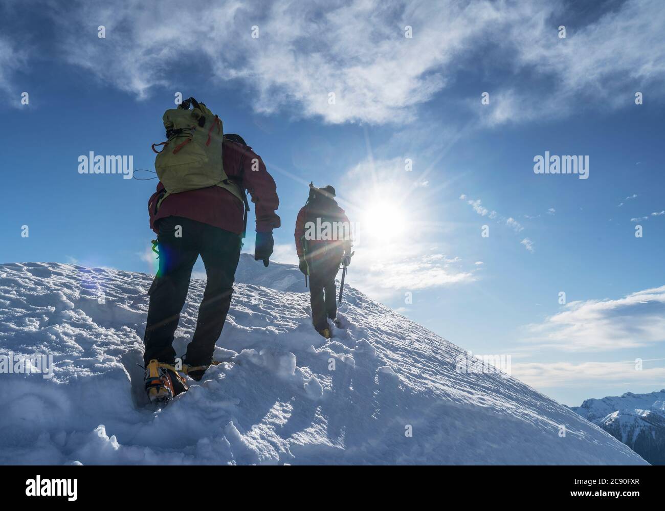 Italy, Alps, Monte Rosa, Climbers reaching snowcapped mountain top Stock Photo