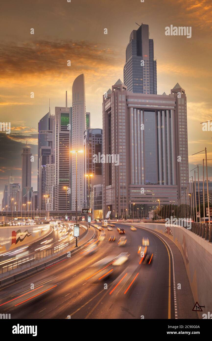 United Arab Emirates, Dubai, Traffic on highway and modern city architecture Stock Photo