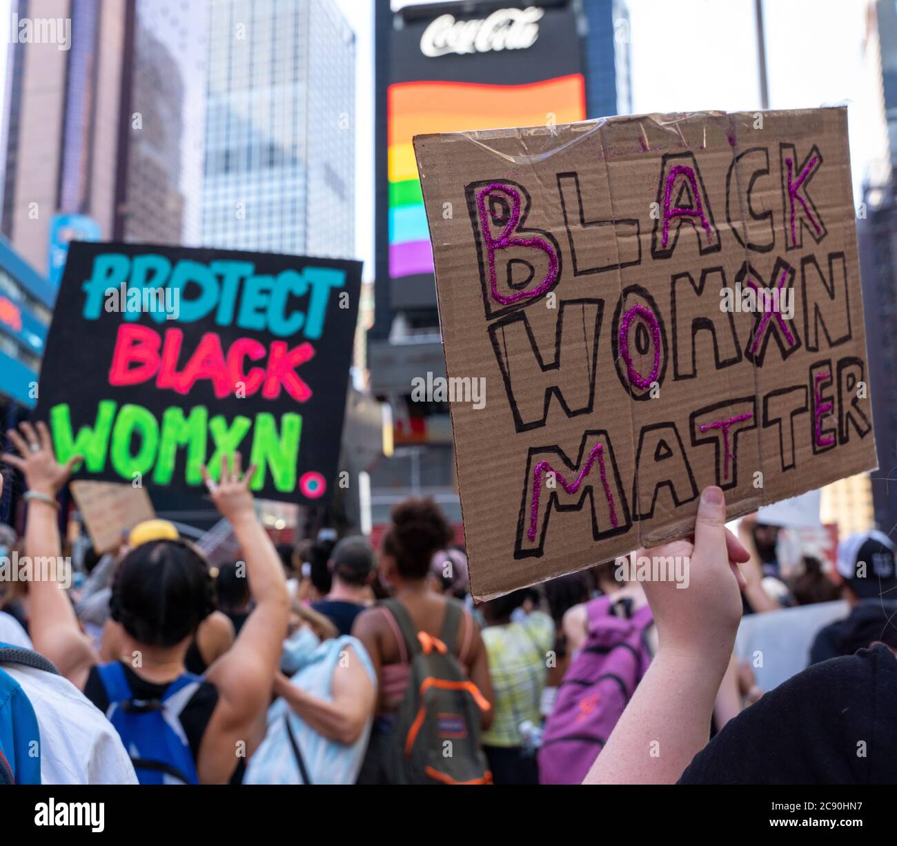 Black Womans/Womxn March Black Lives Matter Protest - Times Square, New York City - Black Womxn Matter Sign in protest crowd Stock Photo