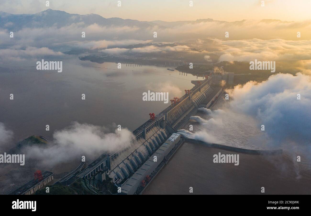 Beijing, China. 27th July, 2020. Aerial photo taken on July 27, 2020 shows floodwater being discharged from the Three Gorges Dam in central China's Hubei Province. The third flood of the year in the Yangtze River occurred in its upper reaches as the Three Gorges reservoir saw an inflow of 50,000 cubic meters per second at 2 p.m. Sunday. Credit: Zheng Jiayu/Xinhua/Alamy Live News Stock Photo