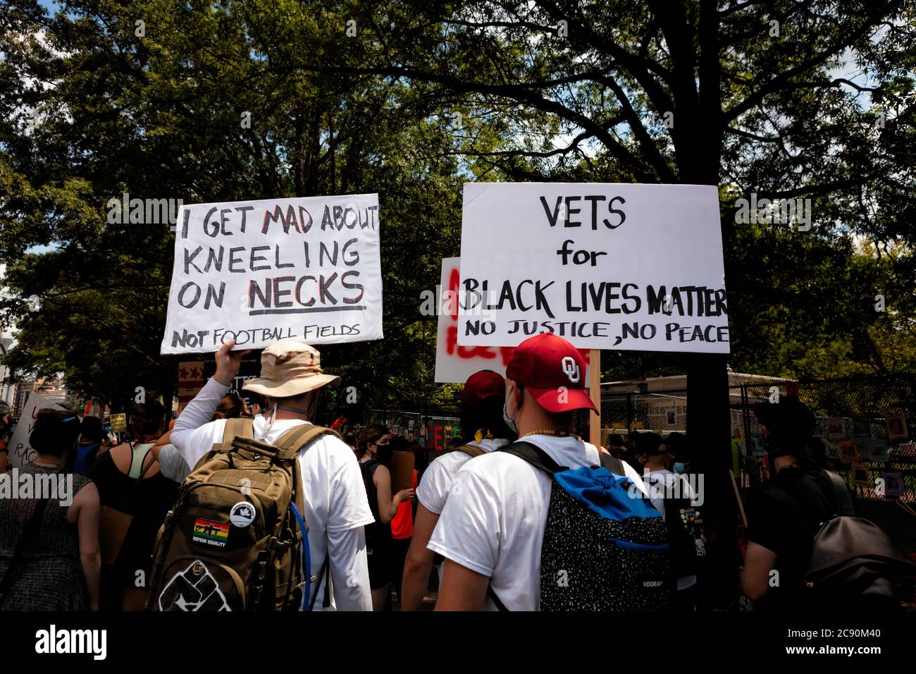 Military veterans carry signs in support of black lives at March Against Trump's Police State, Black Lives Matter Plaza, Washington, DC, United States Stock Photo