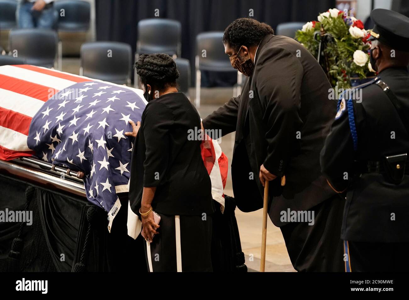 Washington, United States Of America. 27th July, 2020. United States Representative Sheila Jackson Lee (Democrat of Texas), and the Reverend William Barber of Goldsboro, S.C., walk past the flag-draped casket of the late US Representative John Lewis (Democrat of Georgia), as he lies in state at the Capitol in Washington, Monday, July 27, 2020. Credit: J. Scott Applewhite/Pool via CNP | usage worldwide Credit: dpa/Alamy Live News Stock Photo