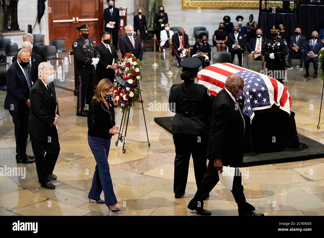 Congressional leadership depart from right, United States House Assistant Democratic Leader James Clyburn (Democrat of South Carolina), Speaker of the US House of Representatives Nancy Pelosi (Democrat of California), US Senate Majority Leader Mitch McConnell (Republican of Kentucky) and US Senate Minority Leader Chuck Schumer (Democrat of New York), depart at the conclusion of a service for the late US Representative John Lewis (Democrat of Georgia), a key figure in the civil rights movement and a 17-term congressman from Georgia, as he lies in state at the Capitol in Washington, Monday, July Stock Photo