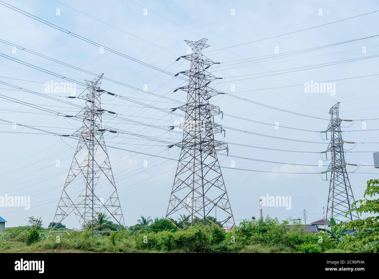 High voltage power lines tower with a blue sky background Stock Photo ...