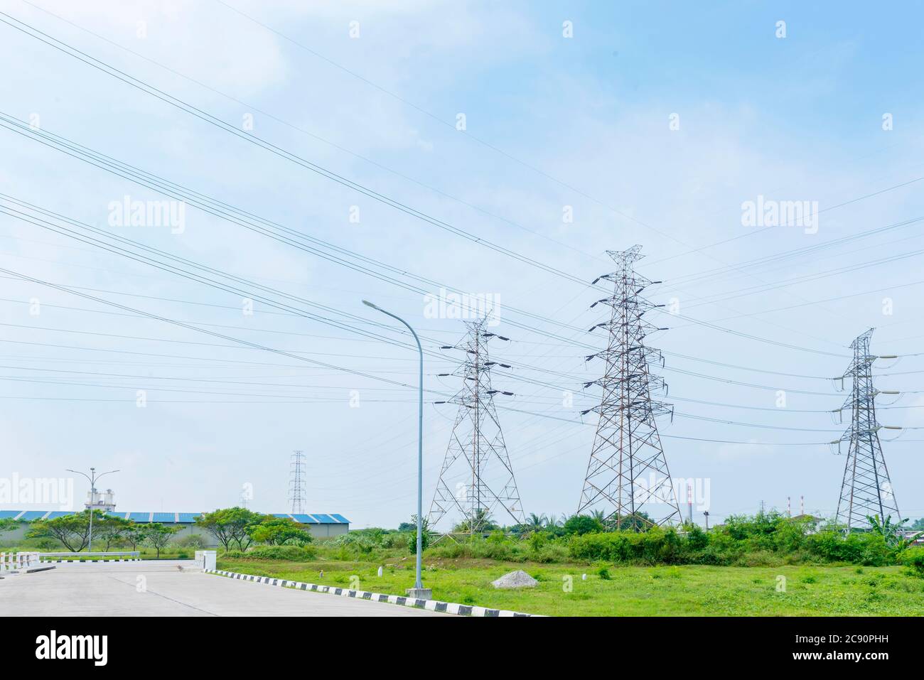 High voltage power lines tower with a blue sky background Stock Photo ...