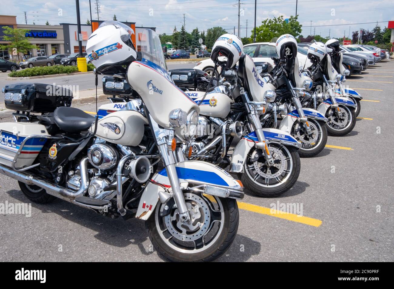 A row of five parked HarleyDavidson motorcycles used by the Ottawa Police in a Barrhaven plaza