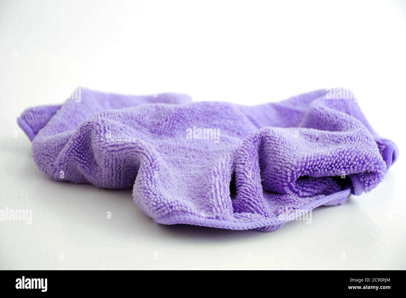 Purple microfiber cloth isolated on white background   X Stock Photo