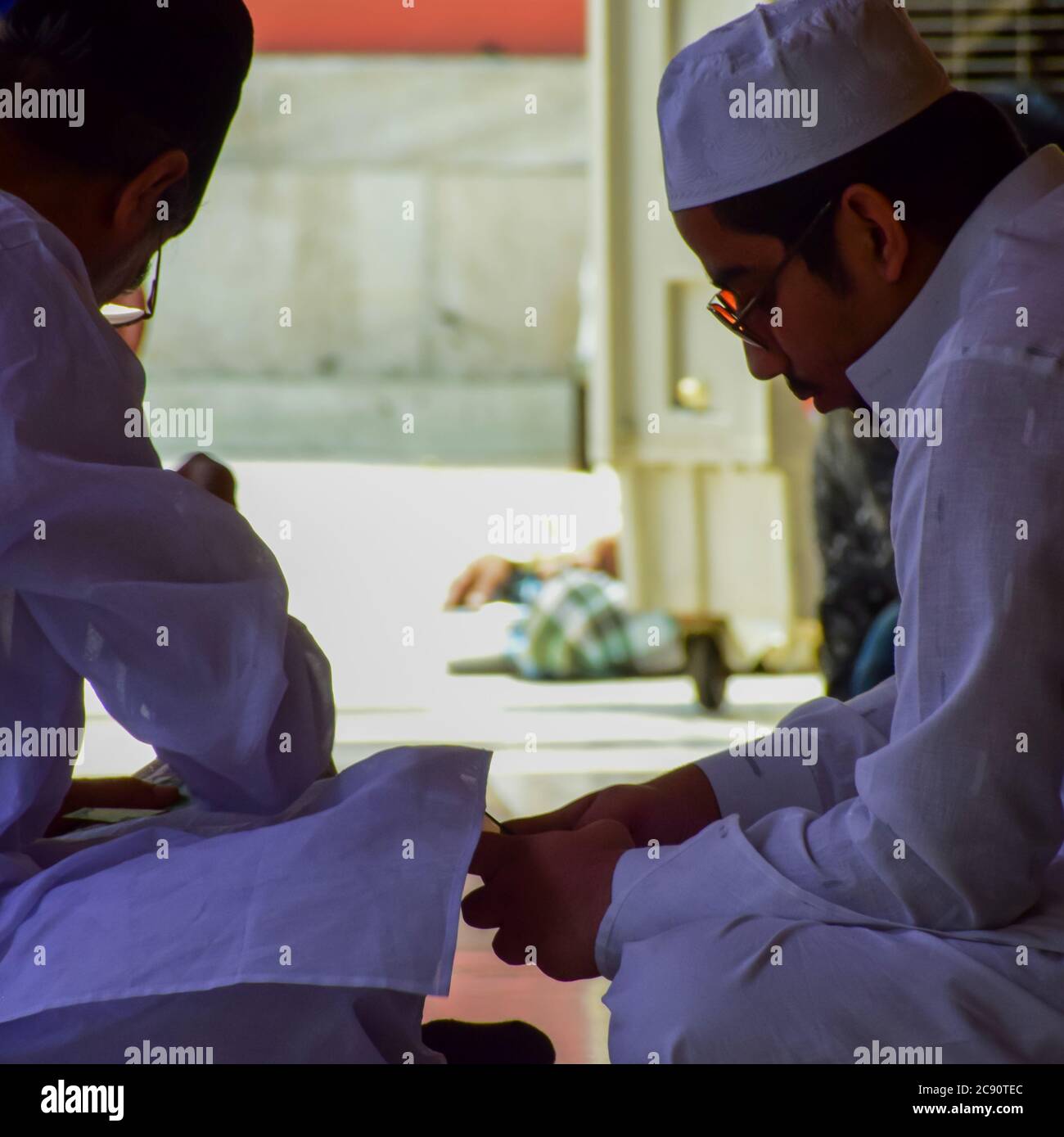 New Delhi India – March 13 2020 : Man Inside Hazrat Nizamuddin Dargah during the day time in Delhi India, Religious Darah of Nizamuddin in Delhi durin Stock Photo