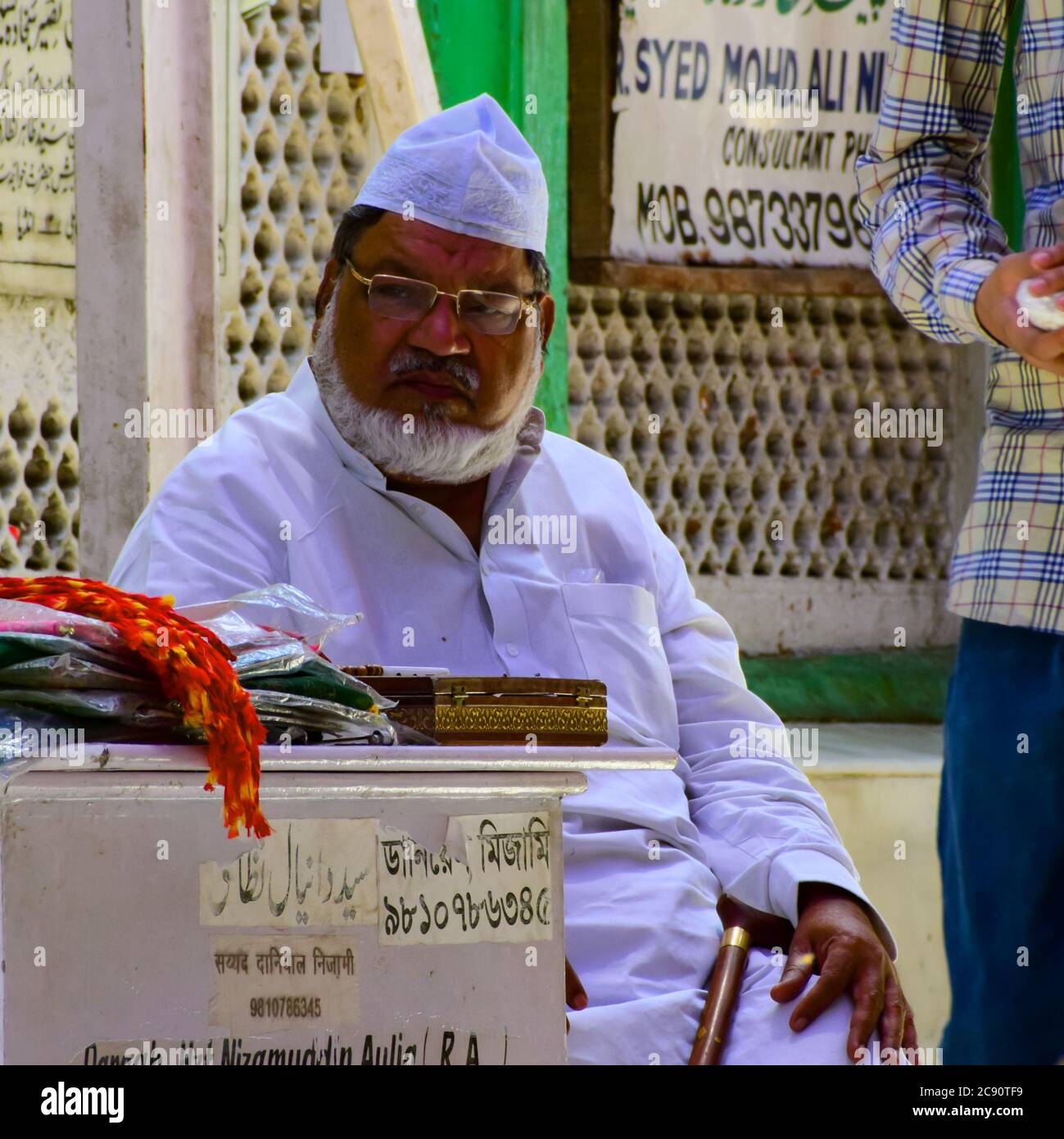 New Delhi India – March 13 2020 : Man Inside Hazrat Nizamuddin Dargah during the day time in Delhi India, Religious Darah of Nizamuddin in Delhi durin Stock Photo