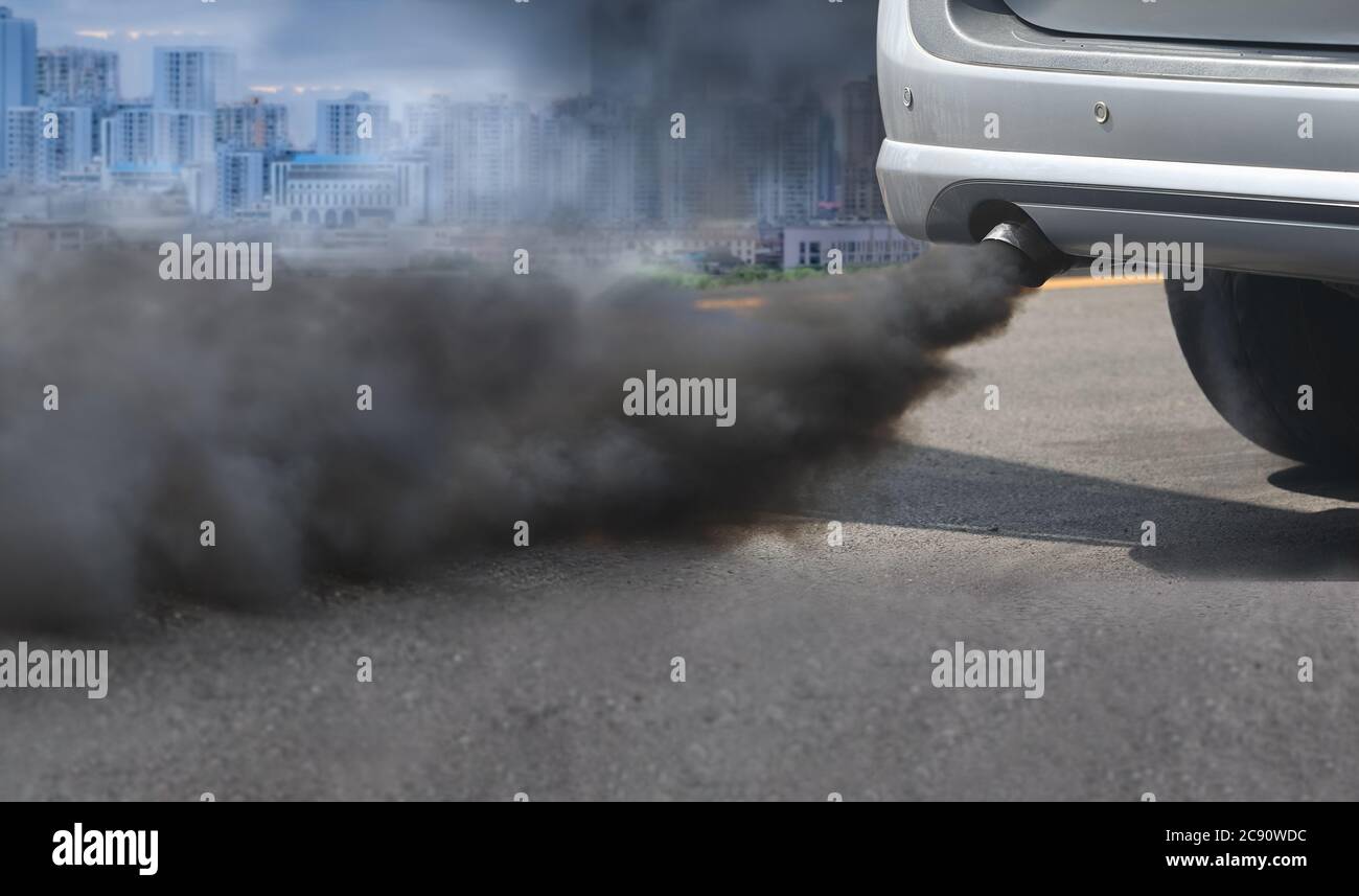 air pollution crisis in city from diesel vehicle exhaust pipe on road