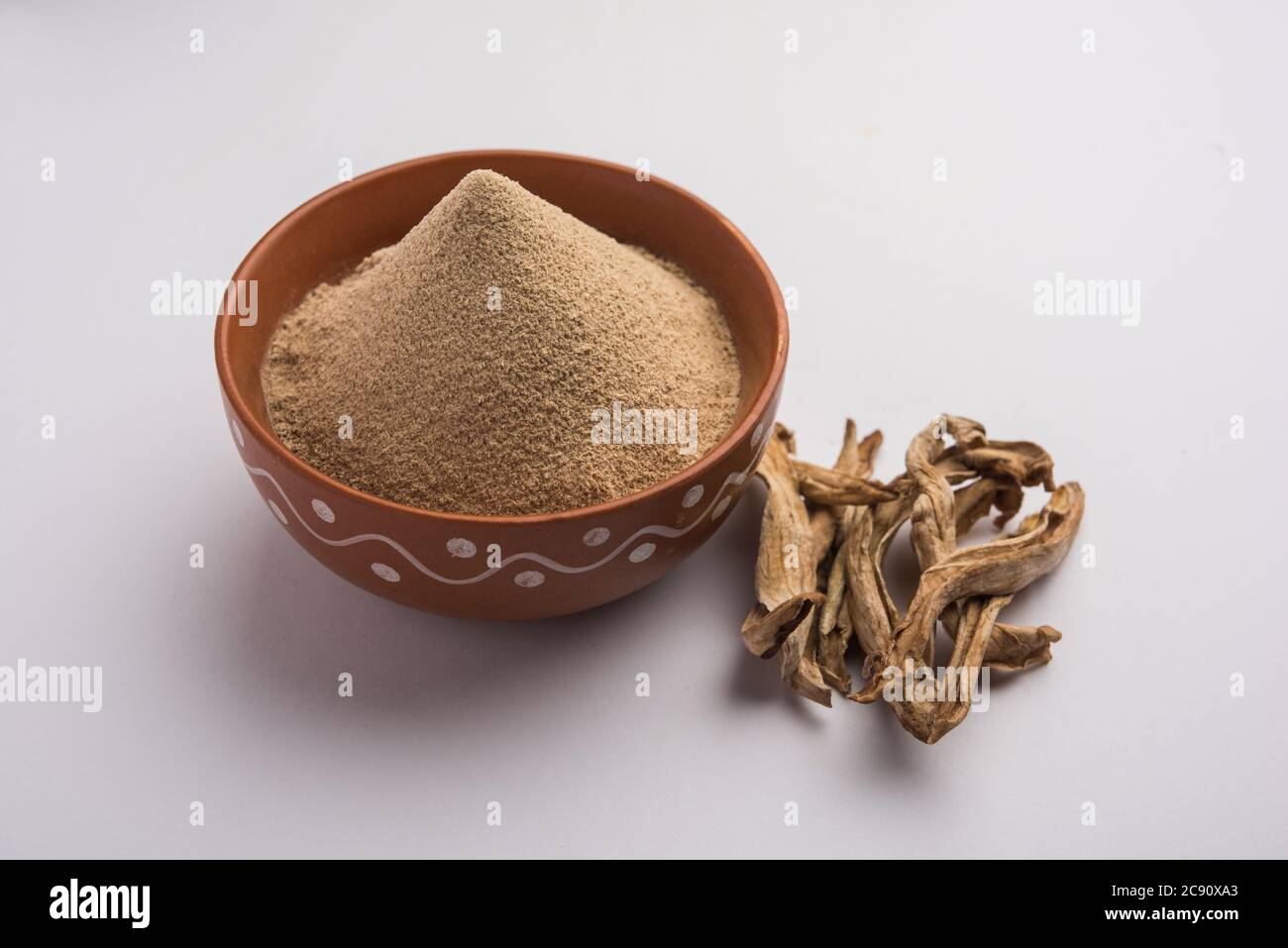 dry mango powder also known as Amchoor or Amchur, it's an Indian Spice with  dried fruit Stock Photo - Alamy