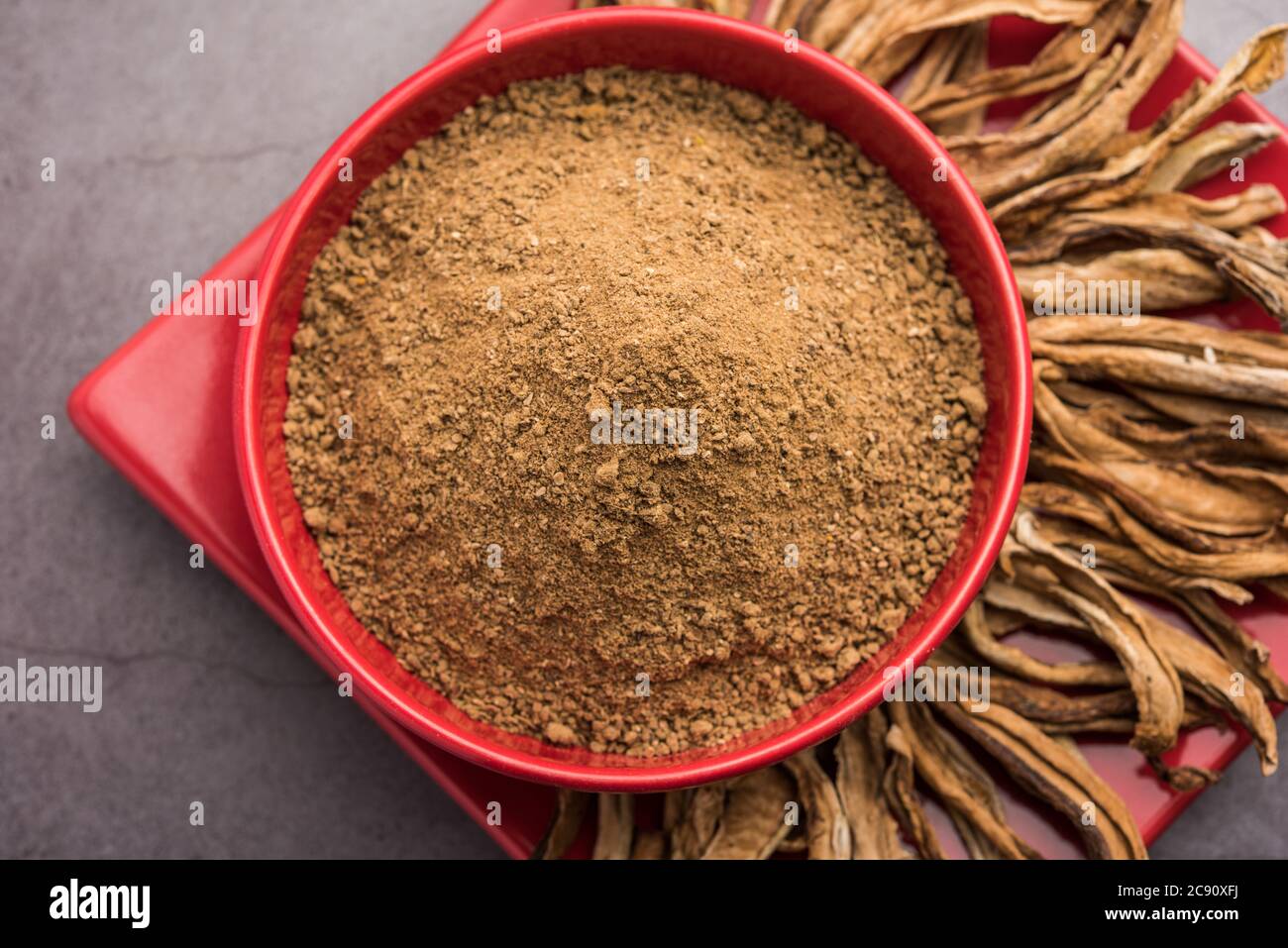 dry mango powder also known as Amchoor or Amchur, it's an Indian Spice with dried fruit Stock Photo